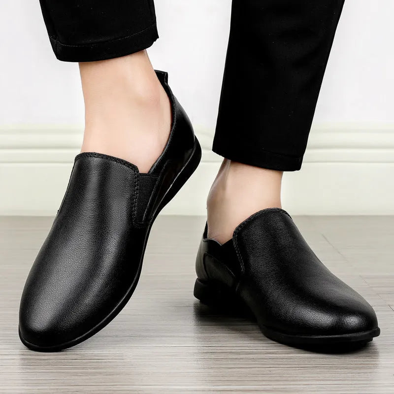 Men's black and brown leather business casual shoes with round toe on a white background.