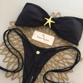 Women's metal ornament split swimsuit in black with snail ornament and removable shoulder straps