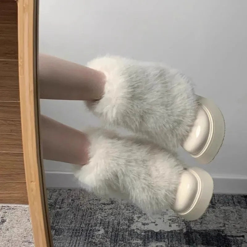 Women's black artificial plush low-top snow boots with a round toe and waterproof rubber sole.