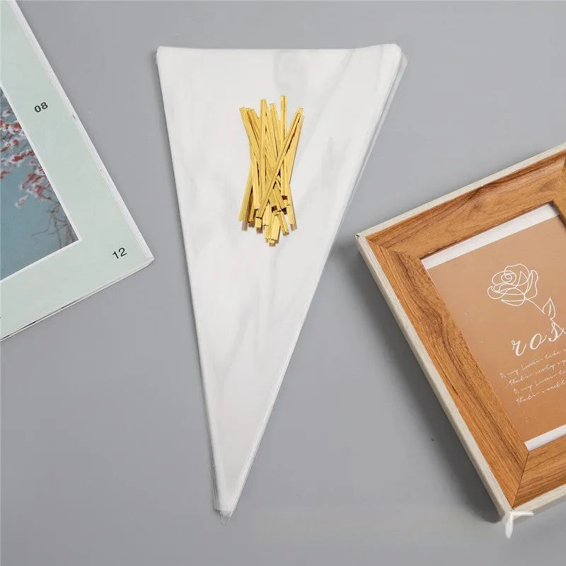 Clear plastic triangle-shaped packaging bag with a silver tie wire closure.