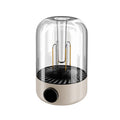 Beige rechargeable LED camping tent light with analog brightness knob and USB port on a wooden surface.