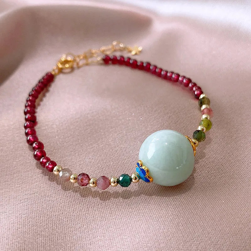 Women's Chinese style bracelet with garnet colour, drop-shaped tourmaline stones and electroplated finish