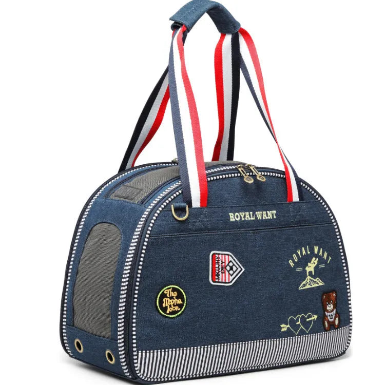 Blue denim pet carrier bag with cartoon pattern measuring 43cm by 20cm by 30cm