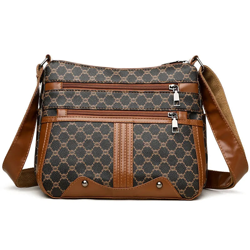 Brown women's crossbody bag with stitching pattern and adjustable shoulder strap.