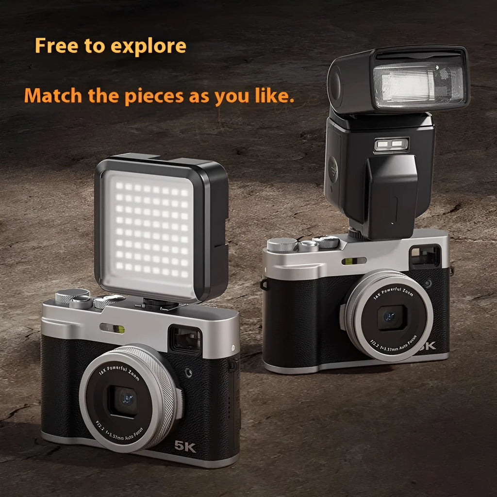 Black or brown 5K HD digital camera with dual lenses and an optical viewfinder on top.