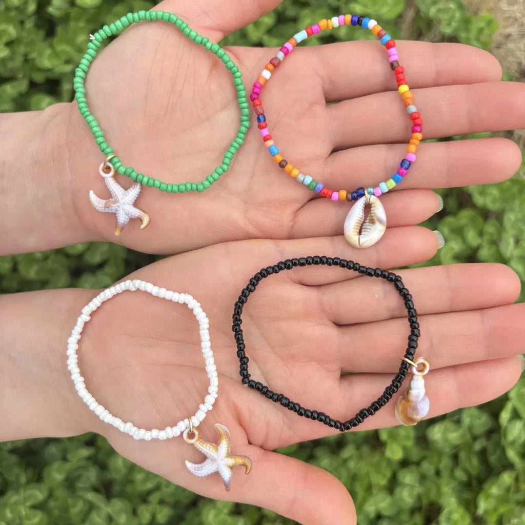 Handmade acrylic rice bead elastic bracelet in doll shape with flower detail, available in multiple colours