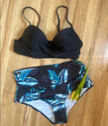 Women's yellow push-up bikini set with high-waisted briefs and a floral printed split design.