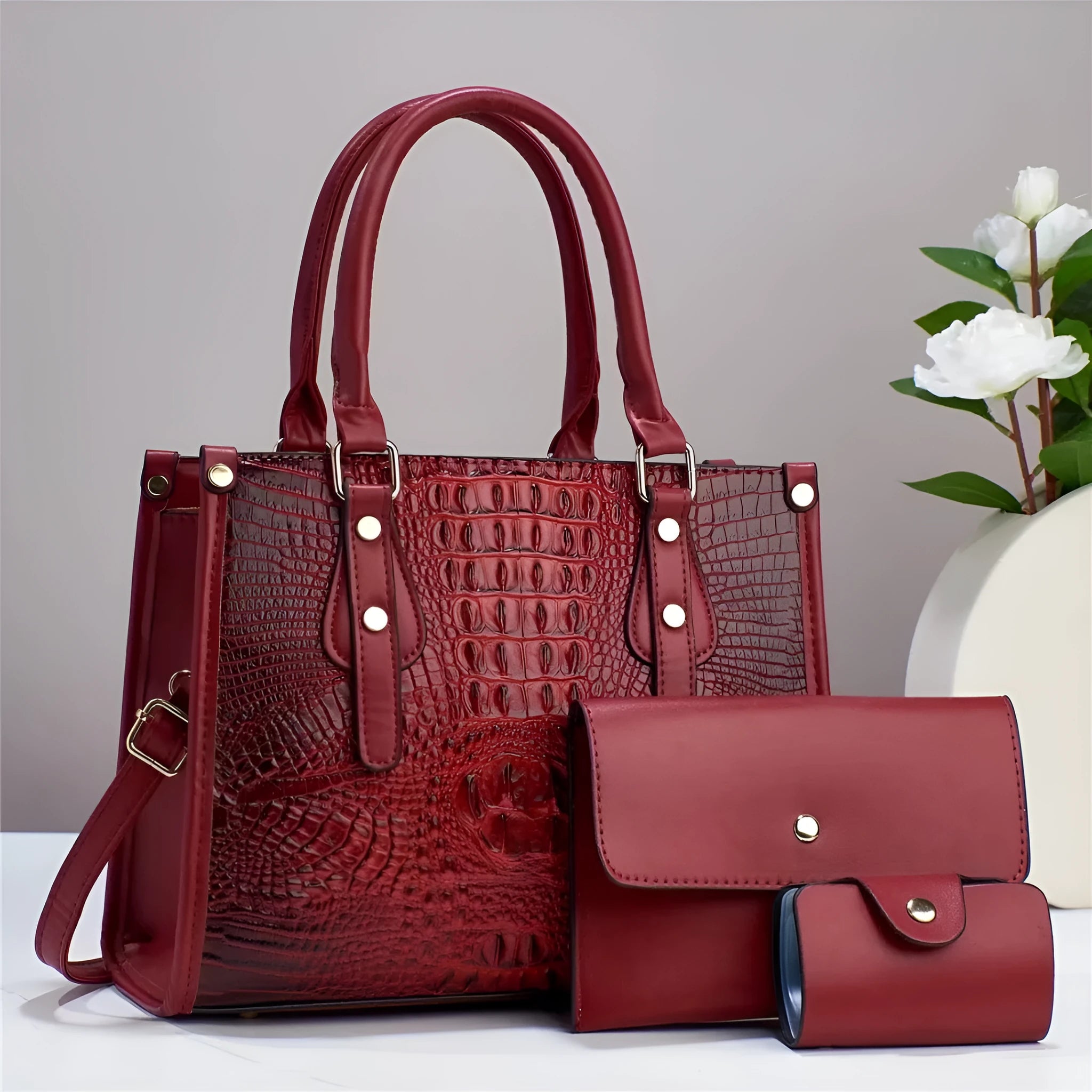 Minimalist contrast texture three-piece crossbody bag set with matching wallet and card holder in burgundy colour