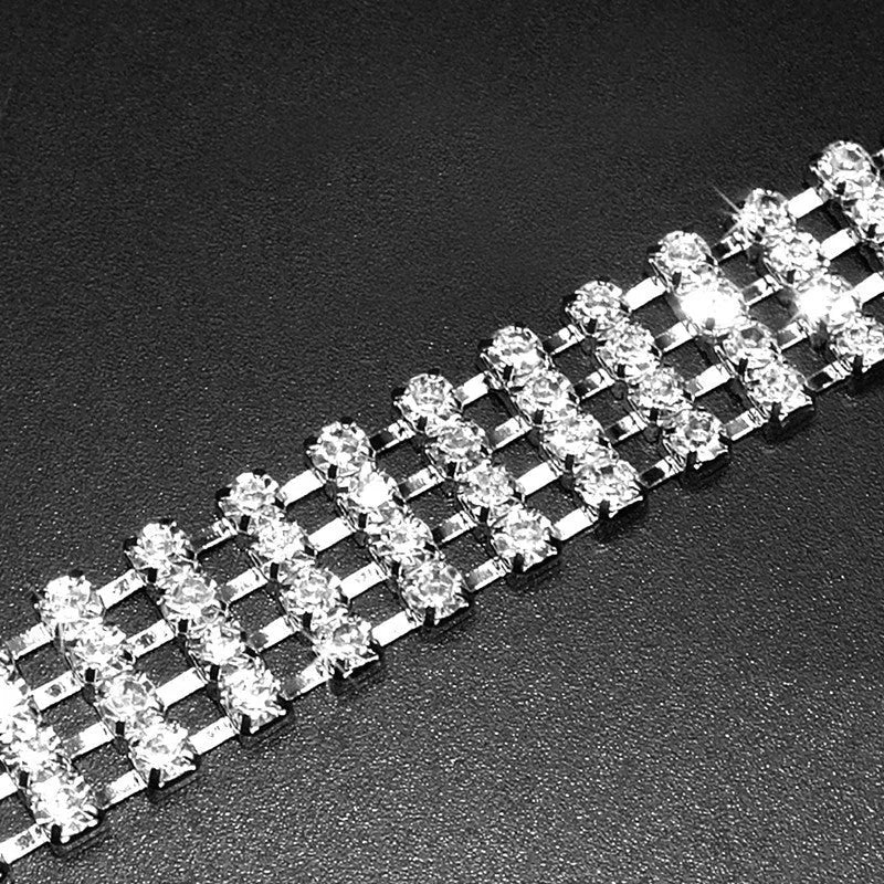 Four-row rhinestone pet collar with heart-shaped chain, silver plated, shown in white, pink, or blue