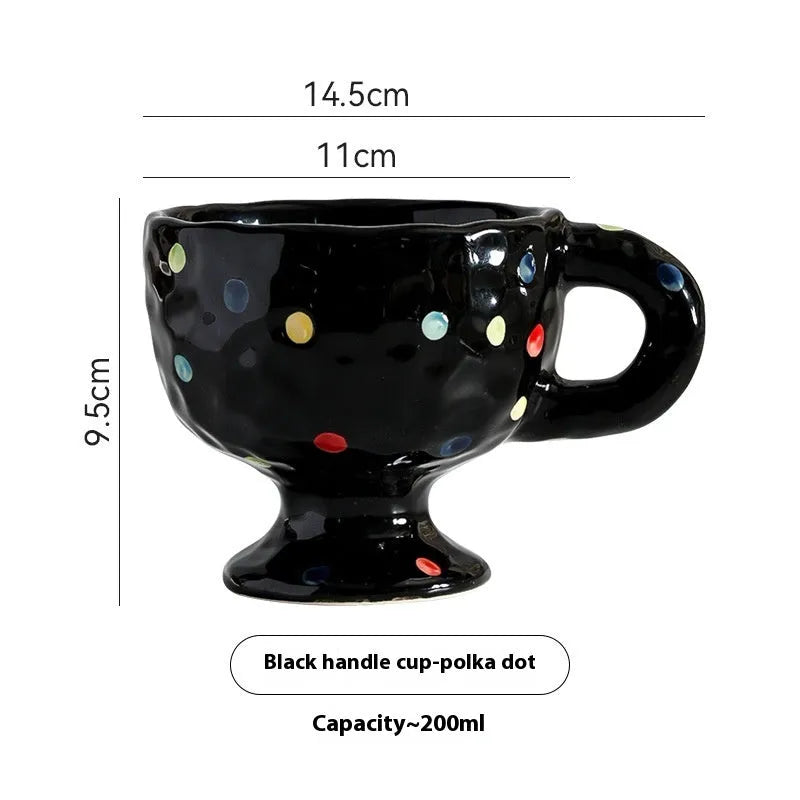 Hand-pinched irregular ceramic mug in a solid colour, showing its unique shape.