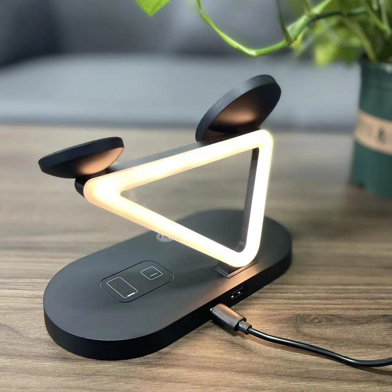 Black and white 3-in-1 wireless charging station for Apple Watch, AirPods and mobile phone.