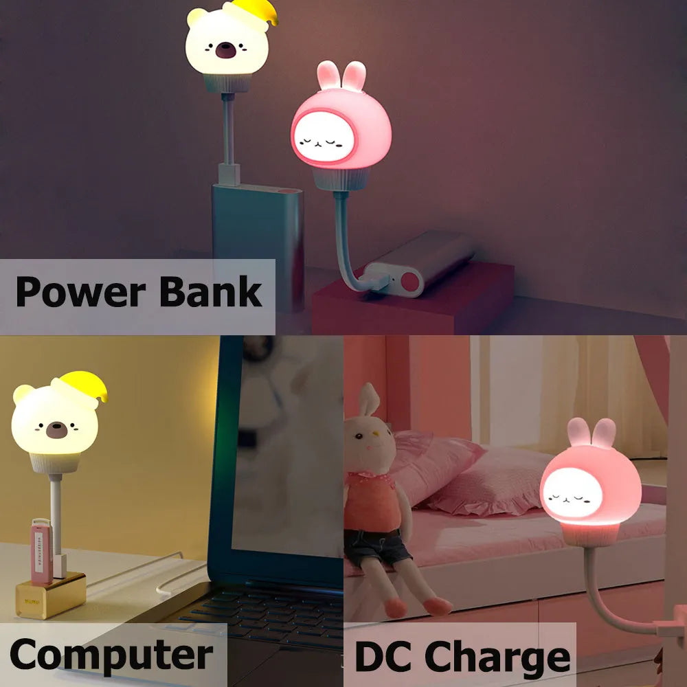 USB portable cartoon animal LED night light with remote control on a bedside table.