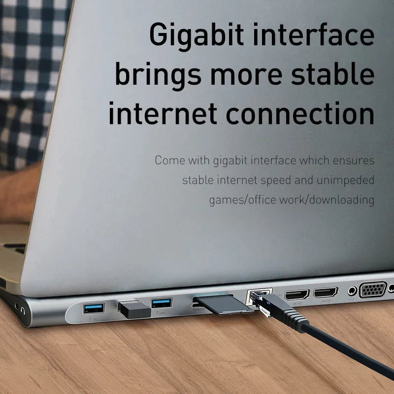 Grey aluminium alloy USB-C hub with cooling bracket showing ten ports including HDMI, VGA, Ethernet and USB