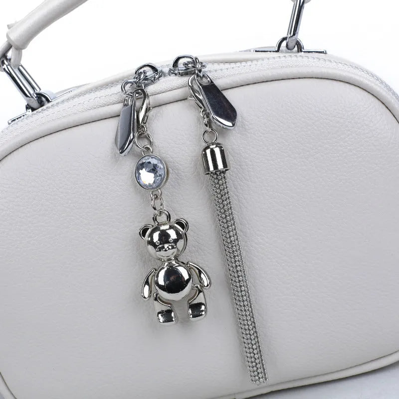 Women's small square stitching bag in PU material showing oval shape and double shoulder straps