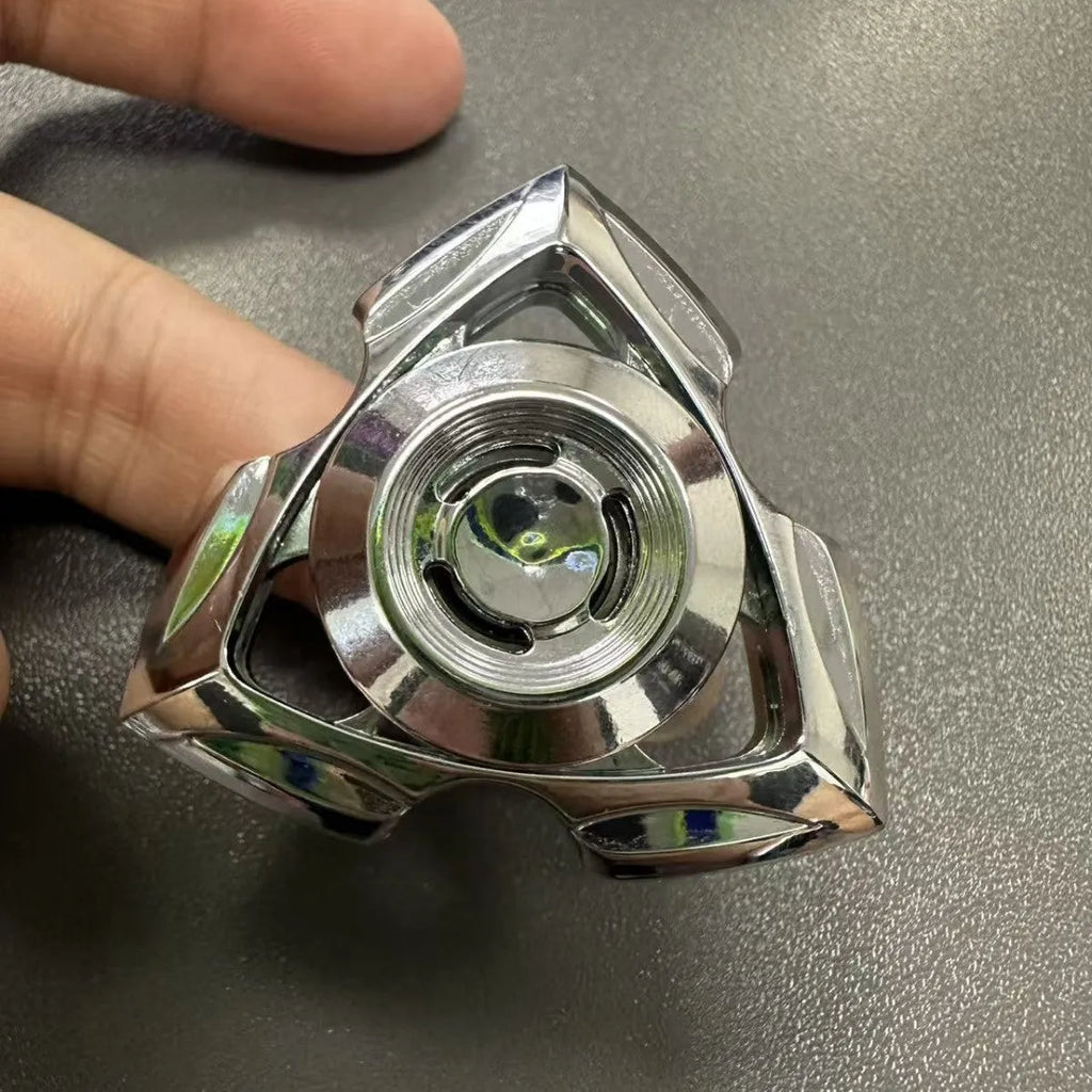 A silver and colourful alloy metal fingertip gyro decompression spinner toy.