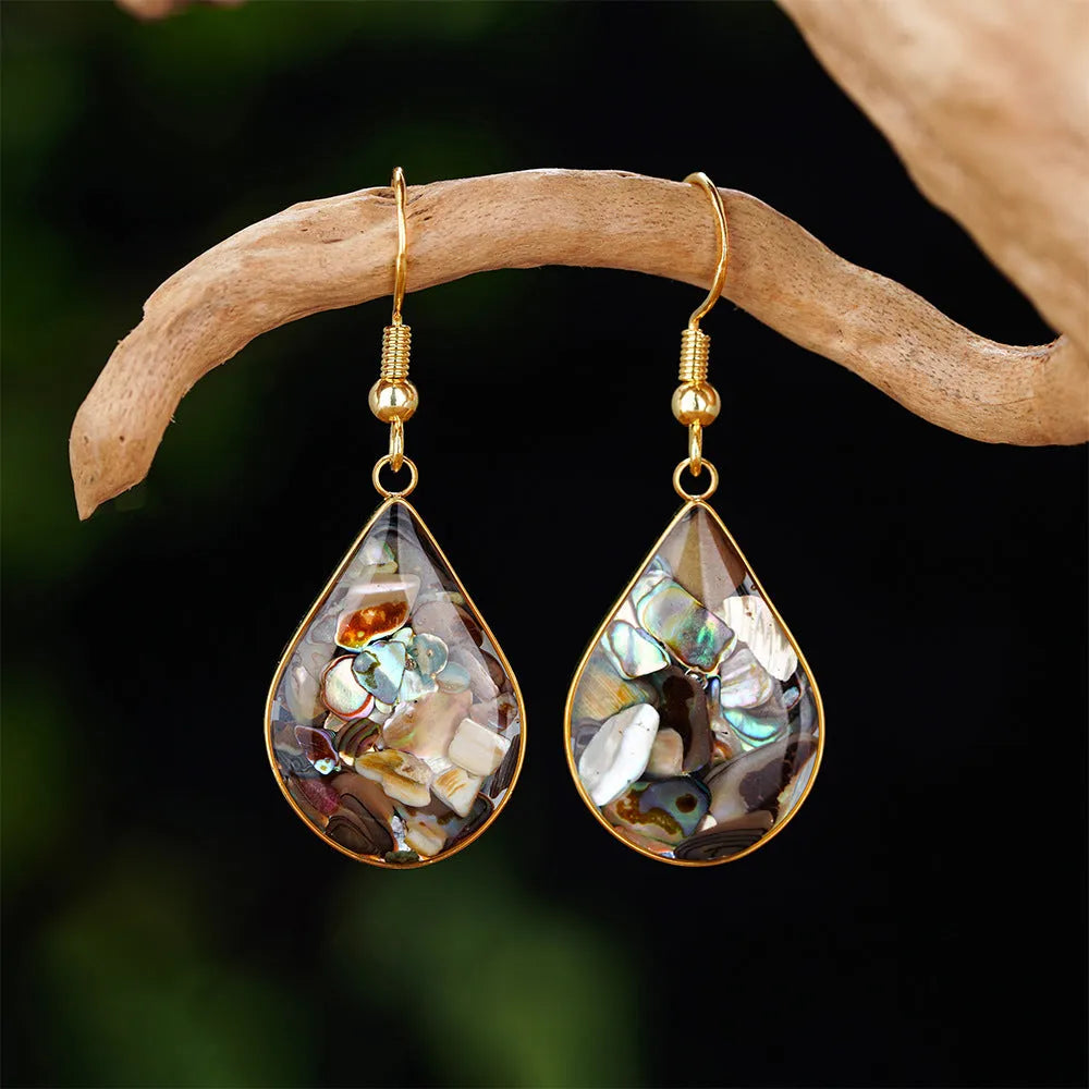 French retro teardrop abalone and shellfish earrings in gold 18K plating on white background