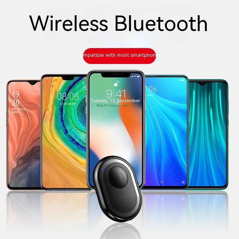 Small black wireless Bluetooth remote control for smartphone photography