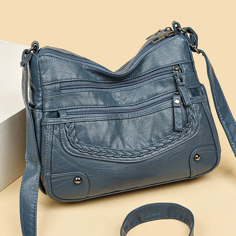 Soft PU messenger bag in horizontal square shape with multiple pockets and sewing thread detailing