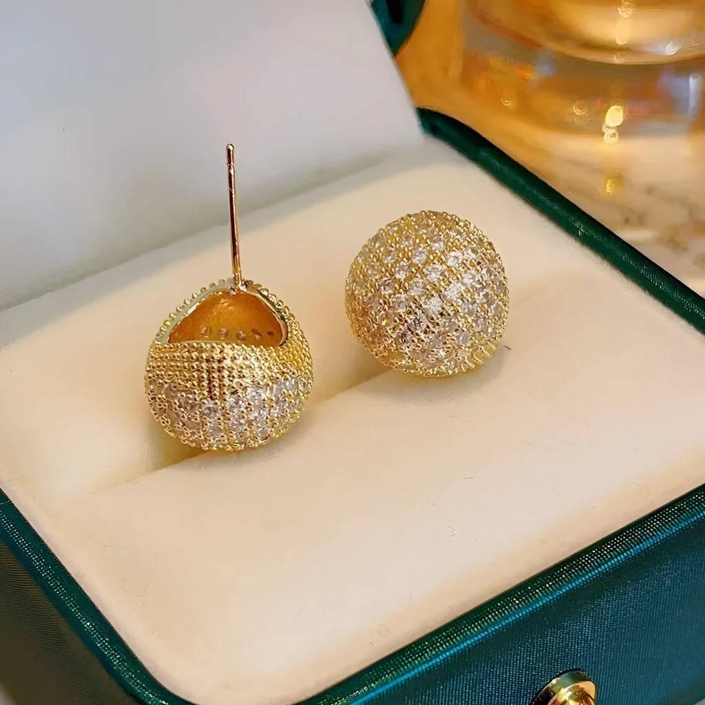 Geometric drop earrings with full diamond pave on golden spherical components in gold and white colour options