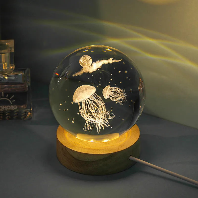 Transparent crystal ball night lamp with 3D carved jellyfish design, showing 6cm size on round base.