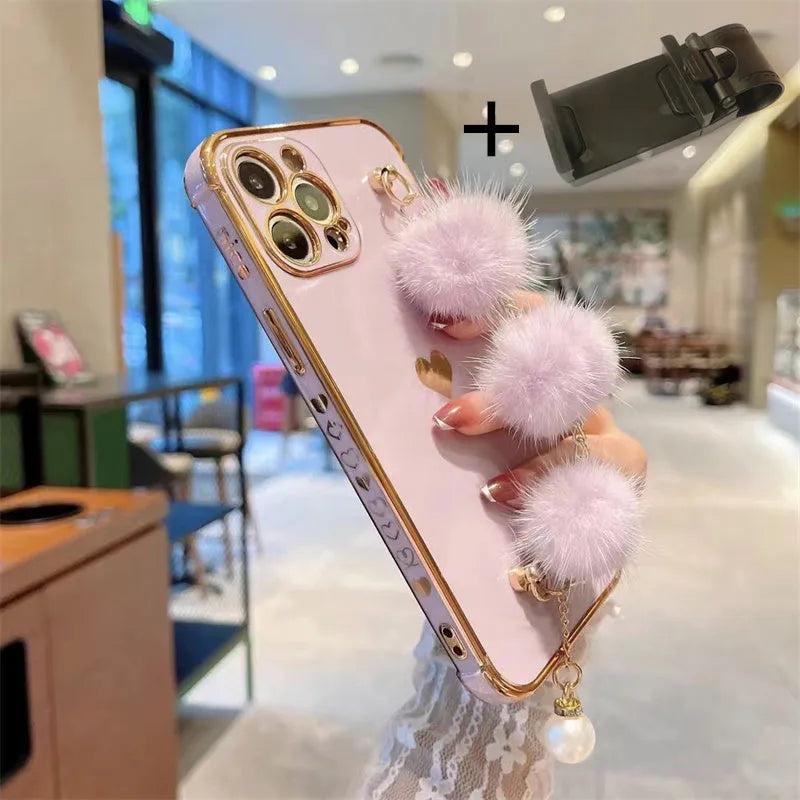 Plush bracelet iPhone case with side love design and holder in black, pink, purple, or white.
