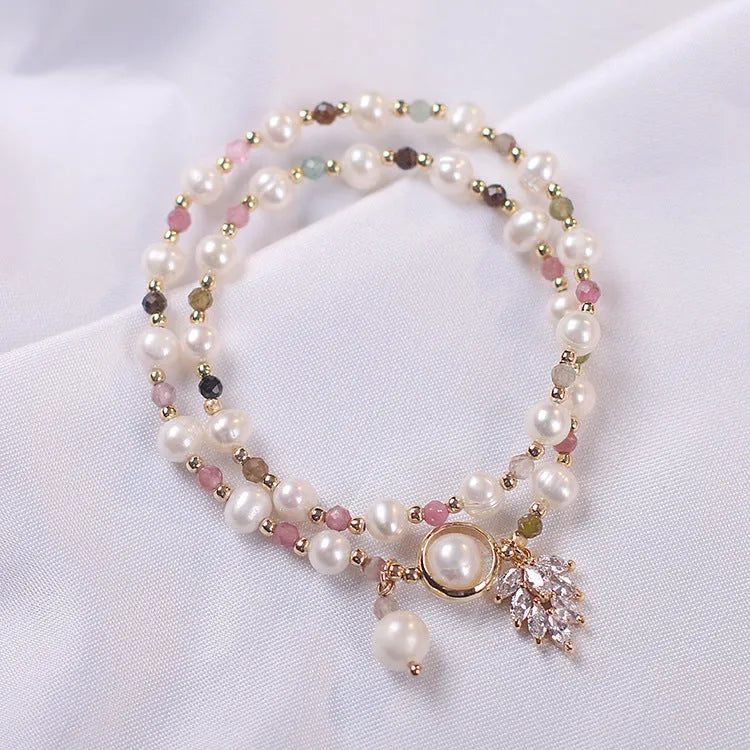 Double layer strawberry quartz bracelet with lucky cat charm in red cat's eye flowers colour