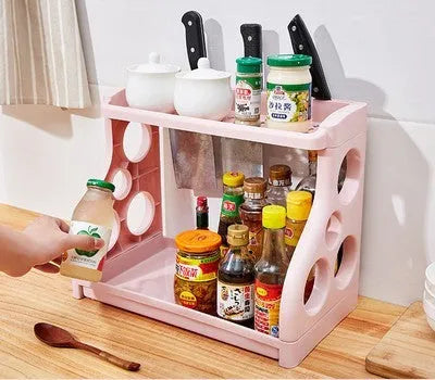 Foldable pink PP kitchen storage shelving unit with multiple tiers for organisation.