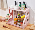 Foldable pink PP kitchen storage shelving unit with multiple tiers for organisation.