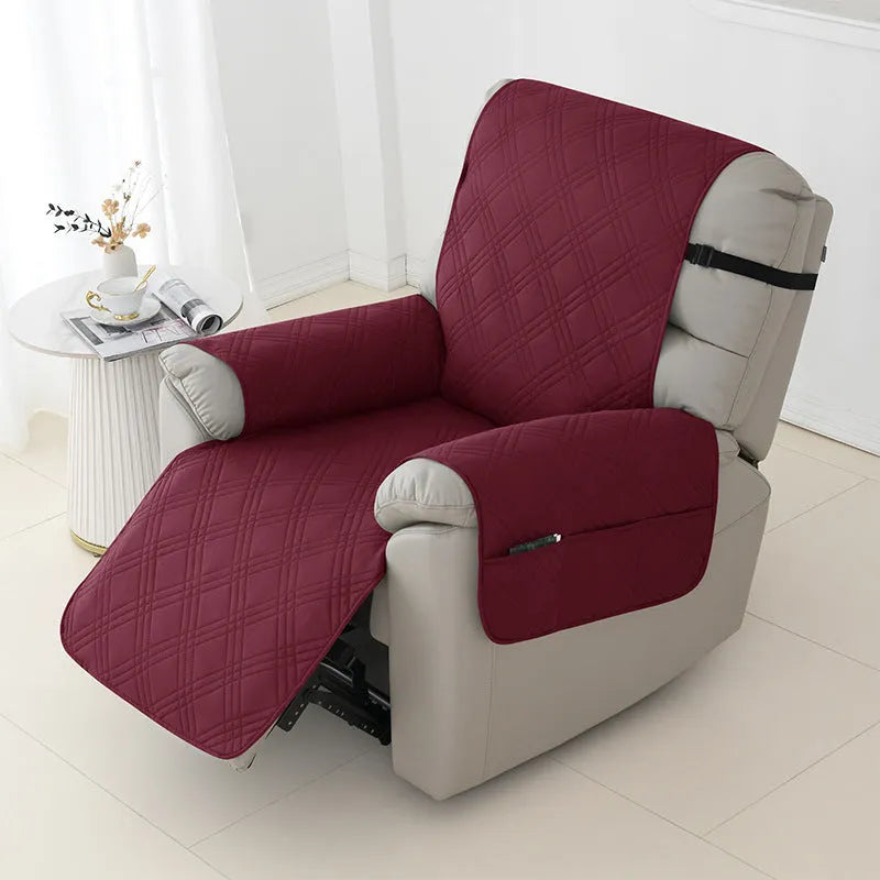 Quilted burgundy waterproof sofa cover stretched over a small single cushion.