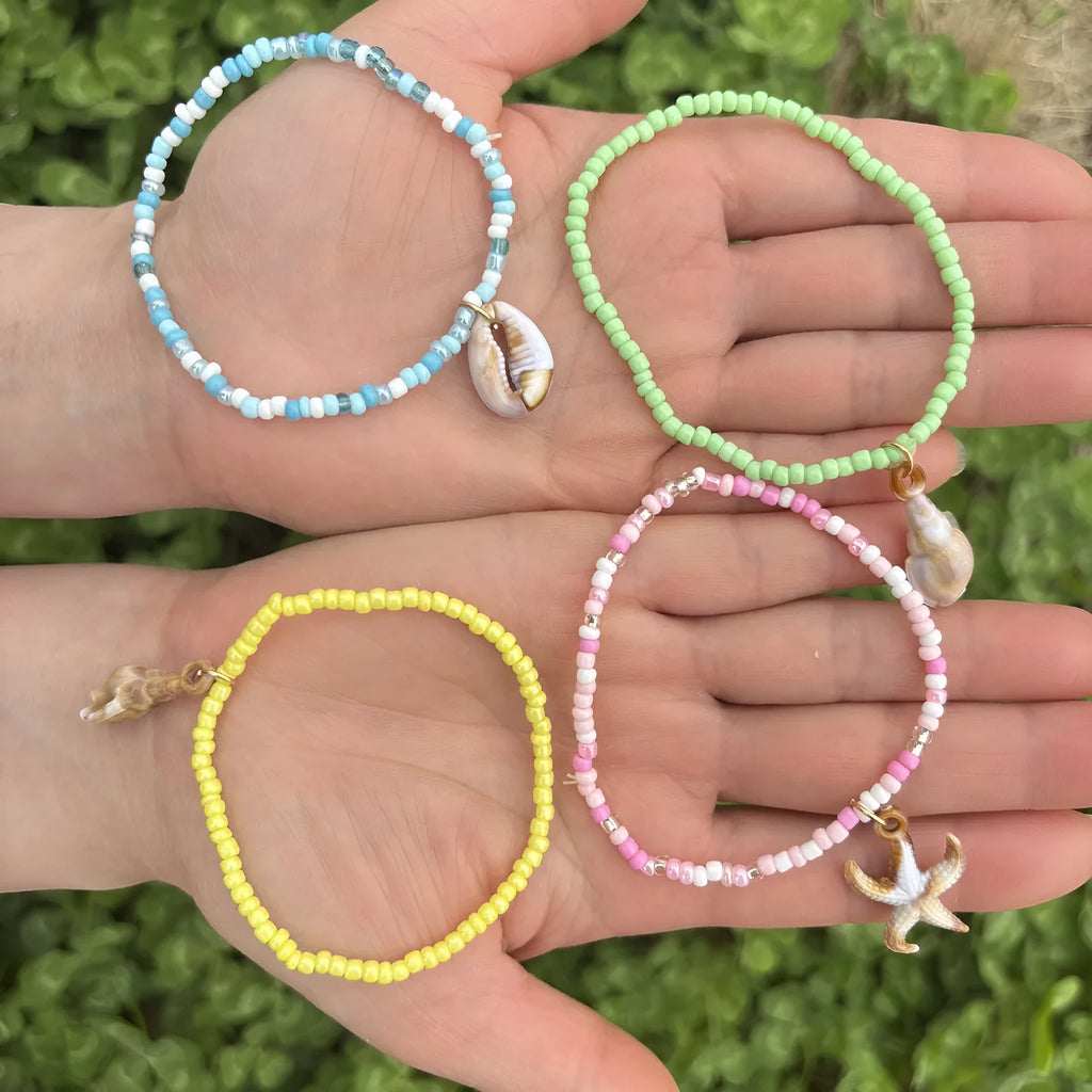 Handmade acrylic rice bead elastic bracelet in doll shape with flower detail, available in multiple colours