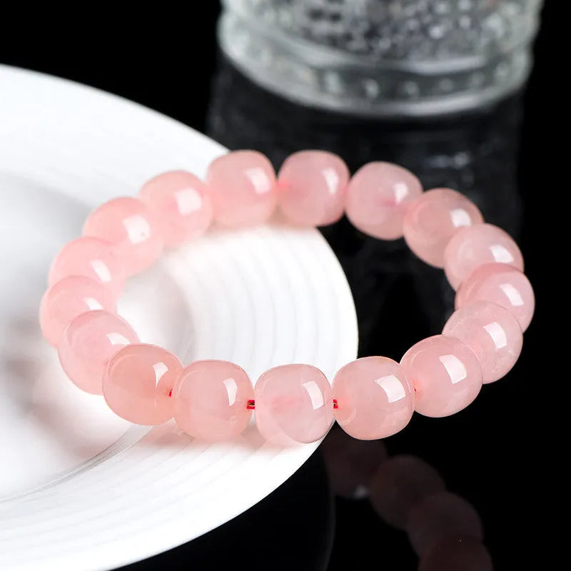 Natural crystal barrel bead bracelet with pink geometry beads measuring 8-10mm