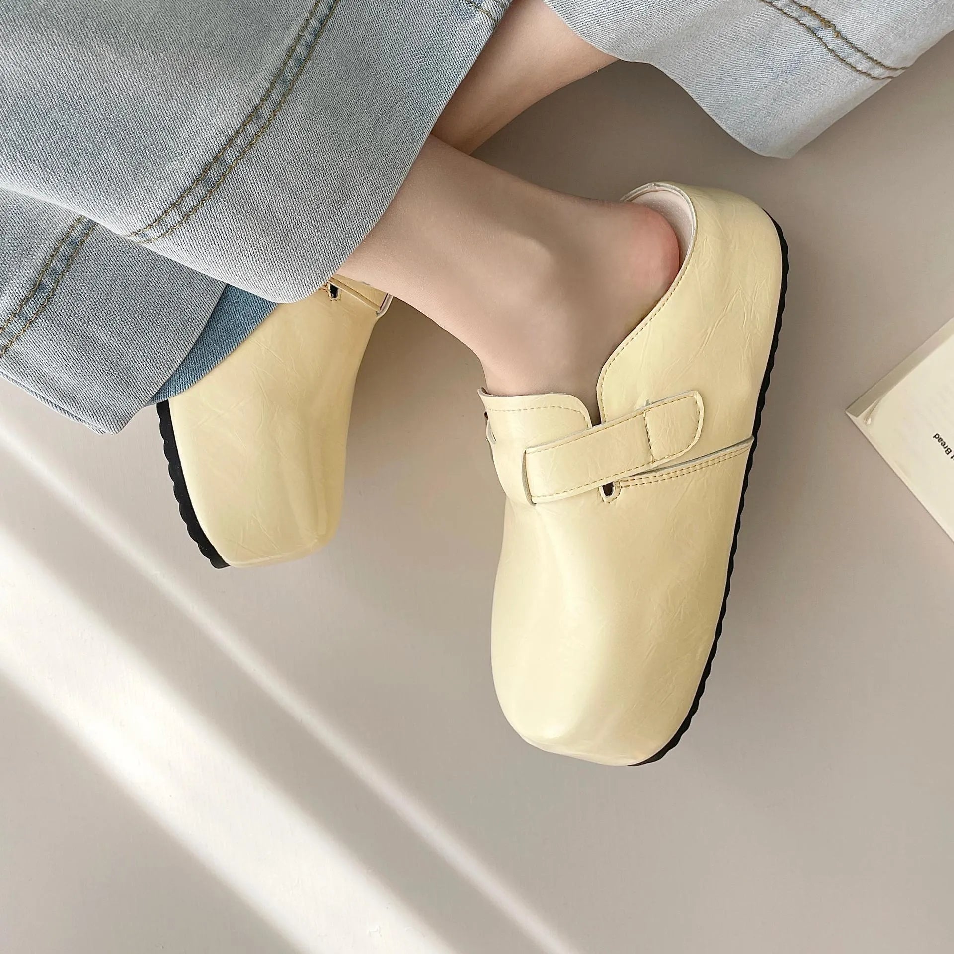 Flat buckle casual sneakers with round toe in yellow, creamy-white, silver, and black colours
