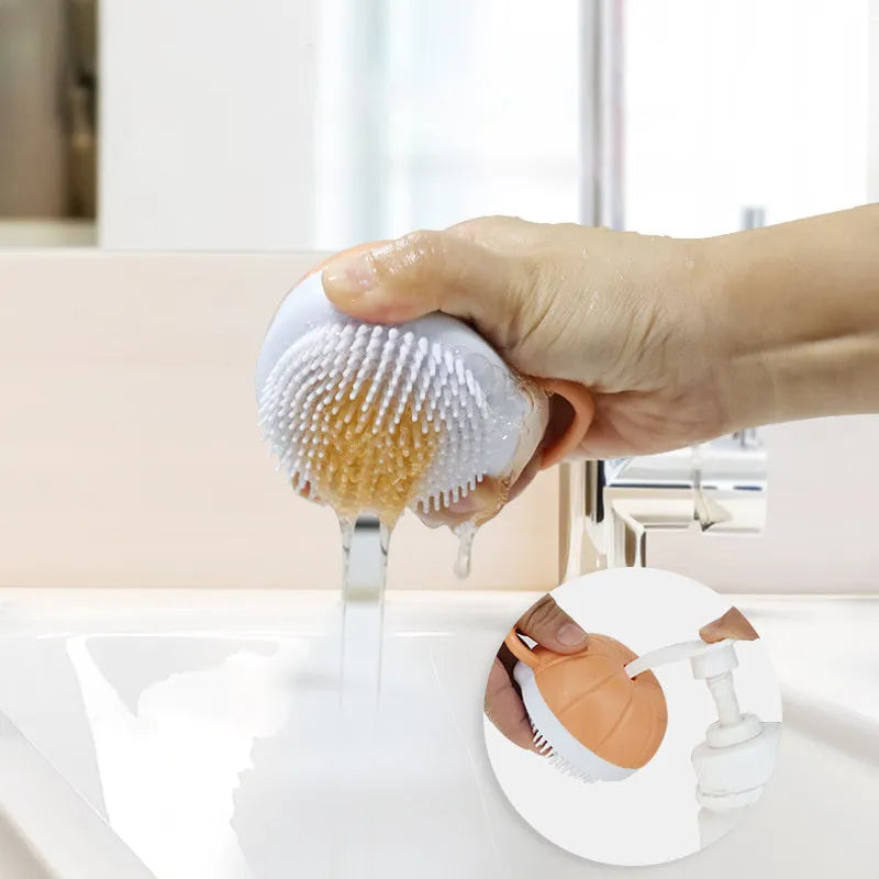 Orange TPR dog bath brush with shampoo dispenser and pumpkin-shaped grip for pet grooming