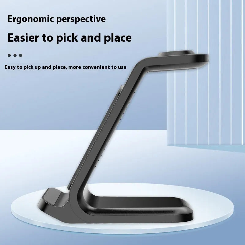 Three-in-one 15W wireless charger vertical stand in black, charging a smartphone and accessories