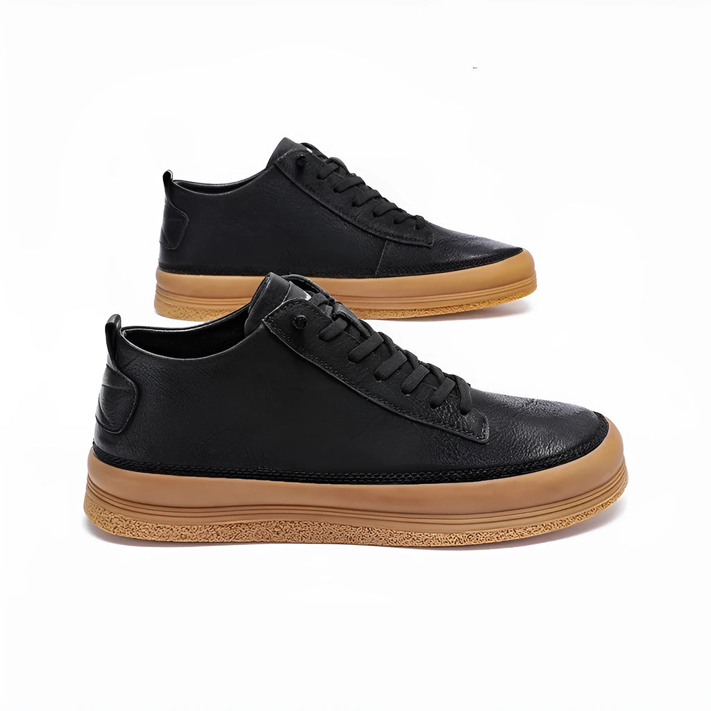 Men's black leather casual shoes with round toe, flat heel, and laced closure on soft rubber sole
