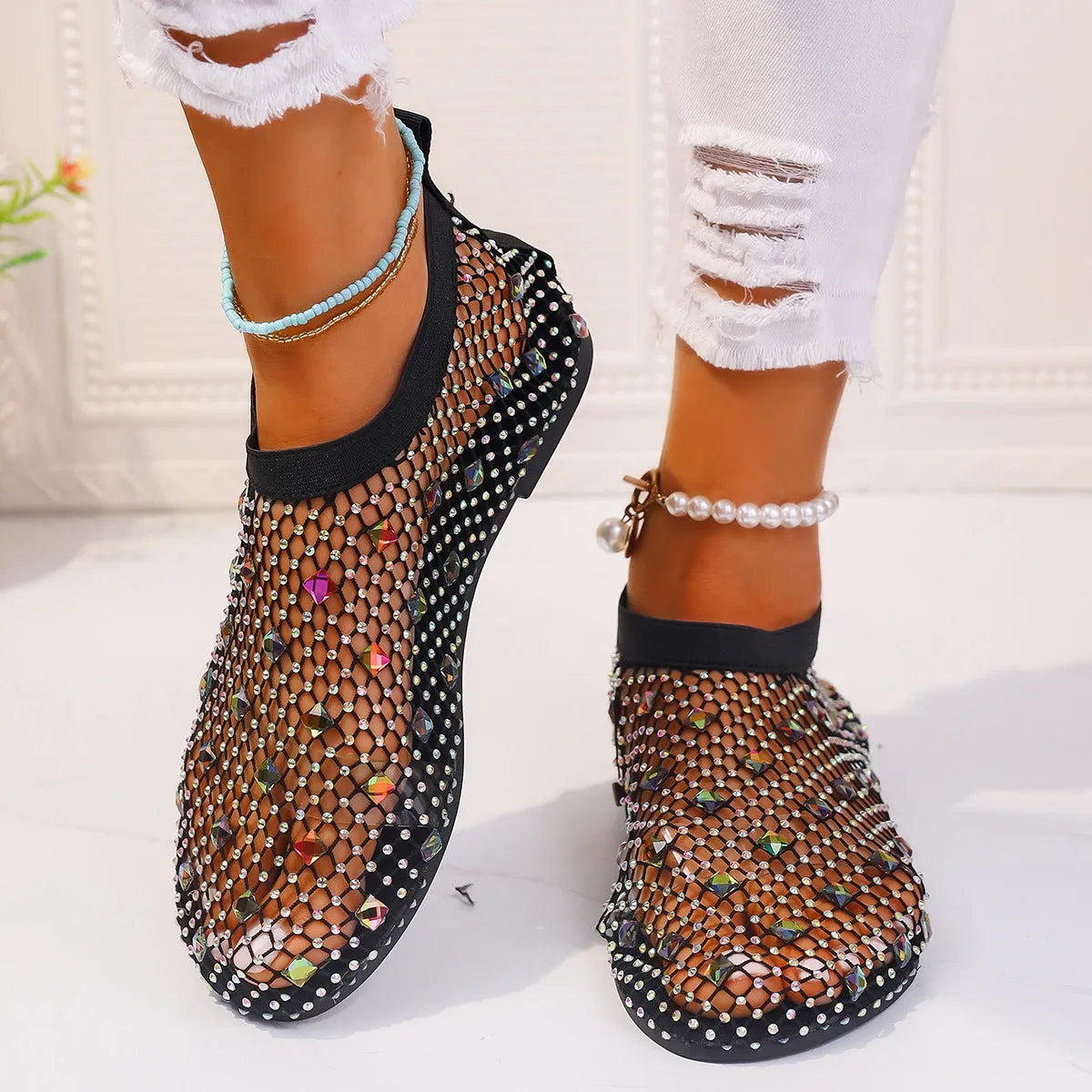 Women's colourful rhinestone mesh flat sandals on white background showing round toe design
