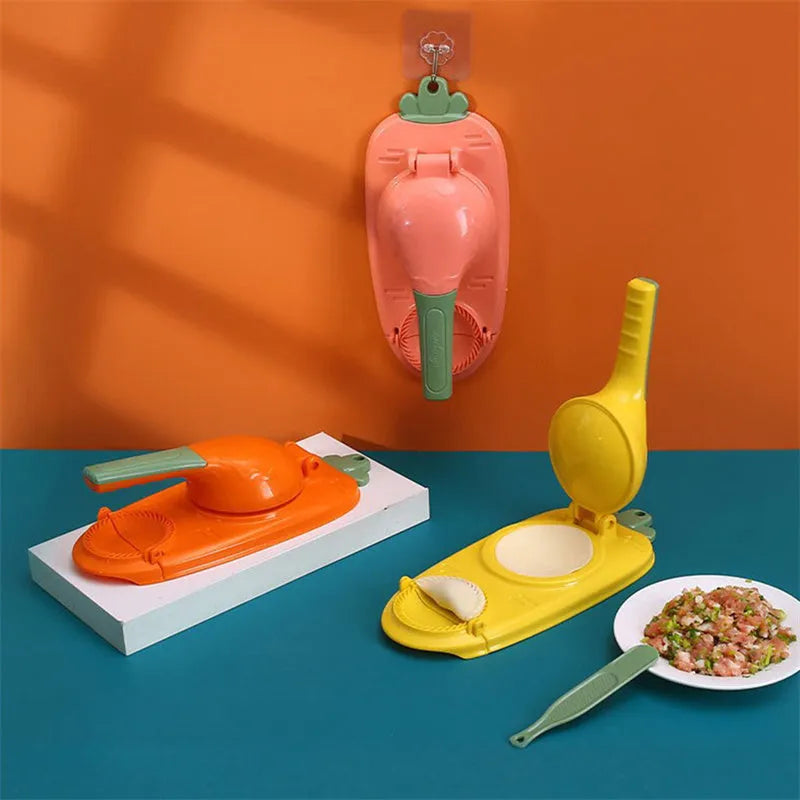 Orange and white manual kitchen dumpling press tool with ergonomic handle on wooden table