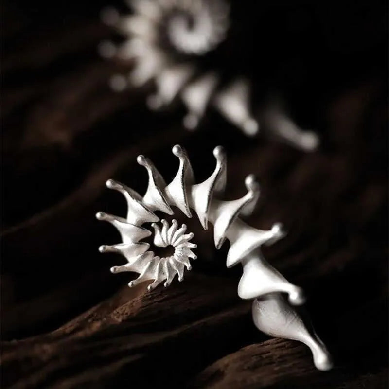 Conch-shaped three-dimensional matte finish alloy ear studs with irregular styling