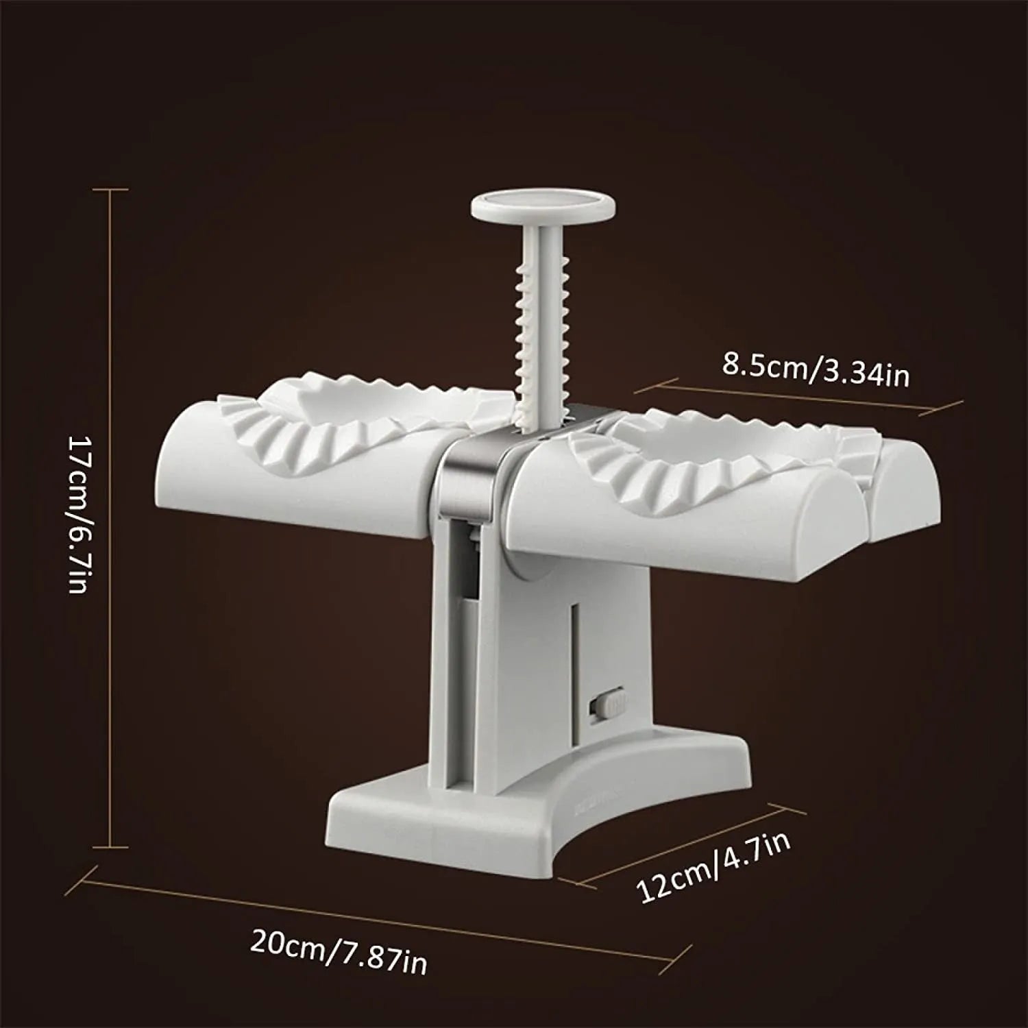 White double head manual dumpling press mould with anti-slip rubber base on kitchen counter.