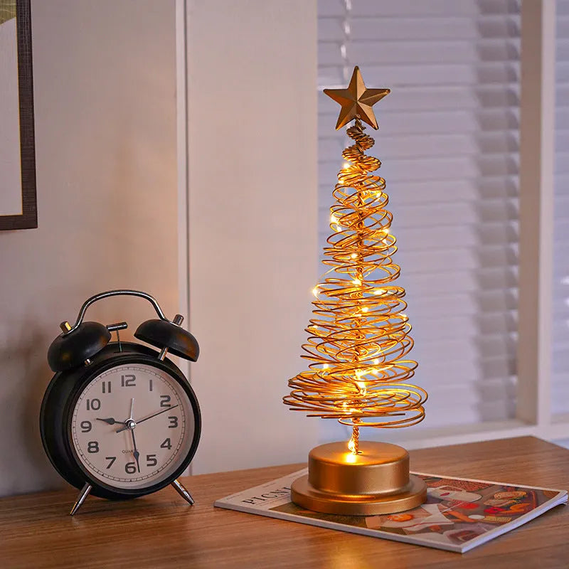 33cm tall metal LED Christmas tree ornament with warm white lights on tabletop