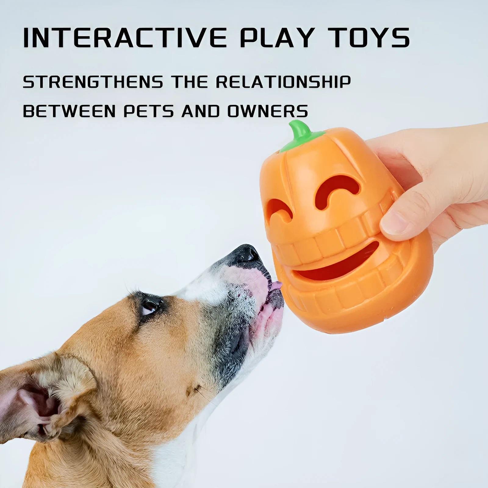 Orange Halloween pumpkin shaped interactive dog chew toy with a treat-dispensing funnel.