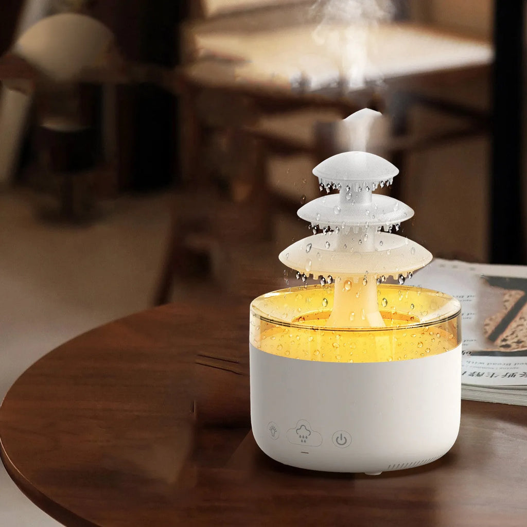 White plastic cloud rain effect USB air humidifier and essential oil diffuser with coloured lights.