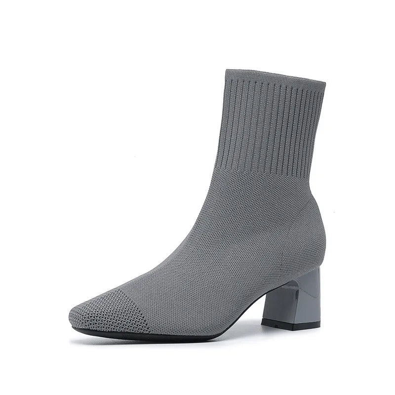 Women's knitted sock boots with chunky high heel, square toe, mid-calf length, rubber sole, available in multiple colours