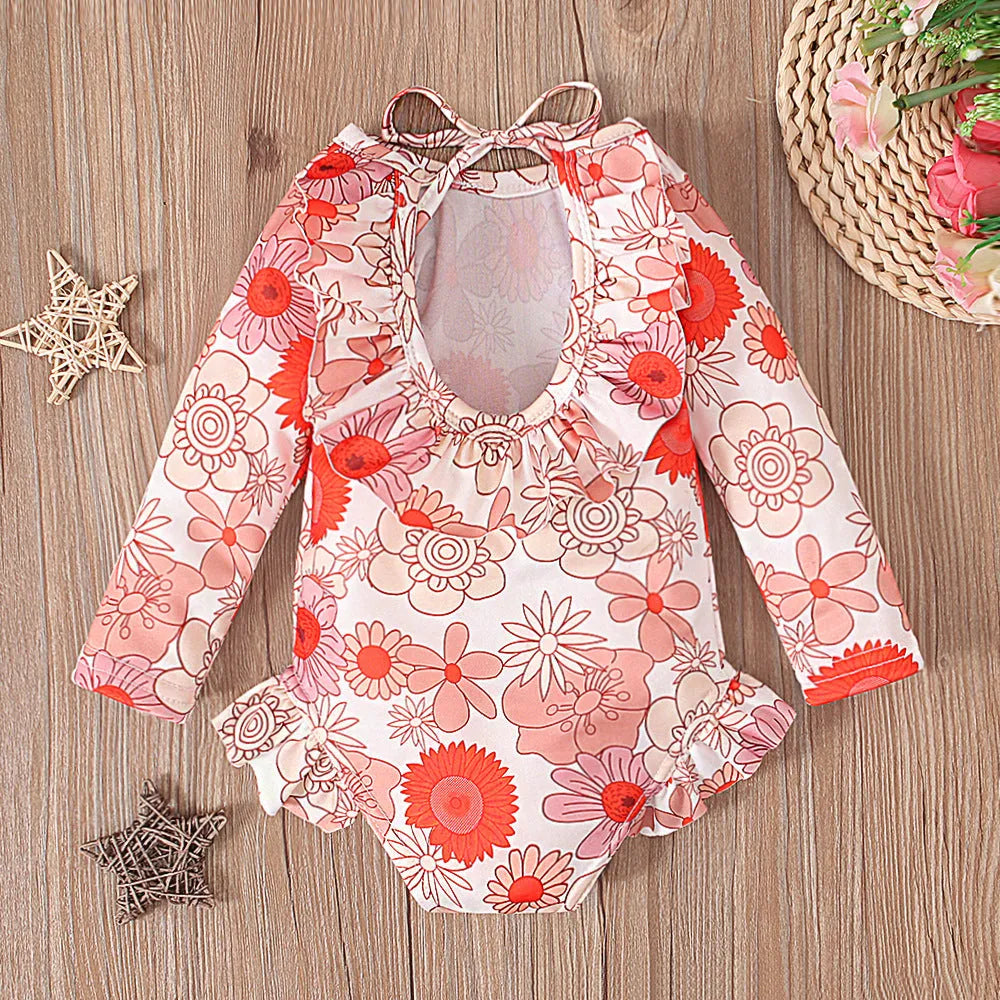 Girl's floral pattern swimsuit with crew neck and open back design in polyester fabric