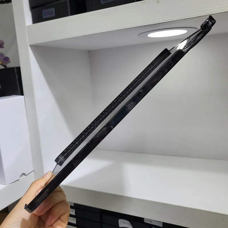 Genuine carbon fibre hard protective case for Apple iPad Pro 11 on a table.