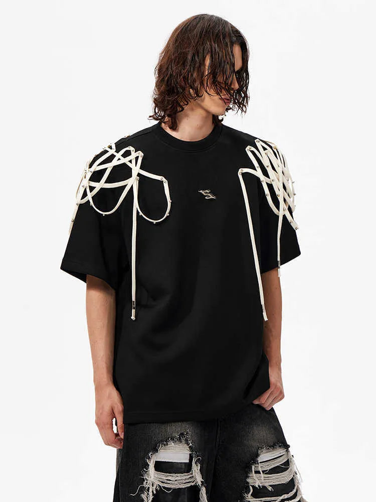 Black loose-fit short-sleeved T-shirt with ribbed padded shoulders on a hanger.