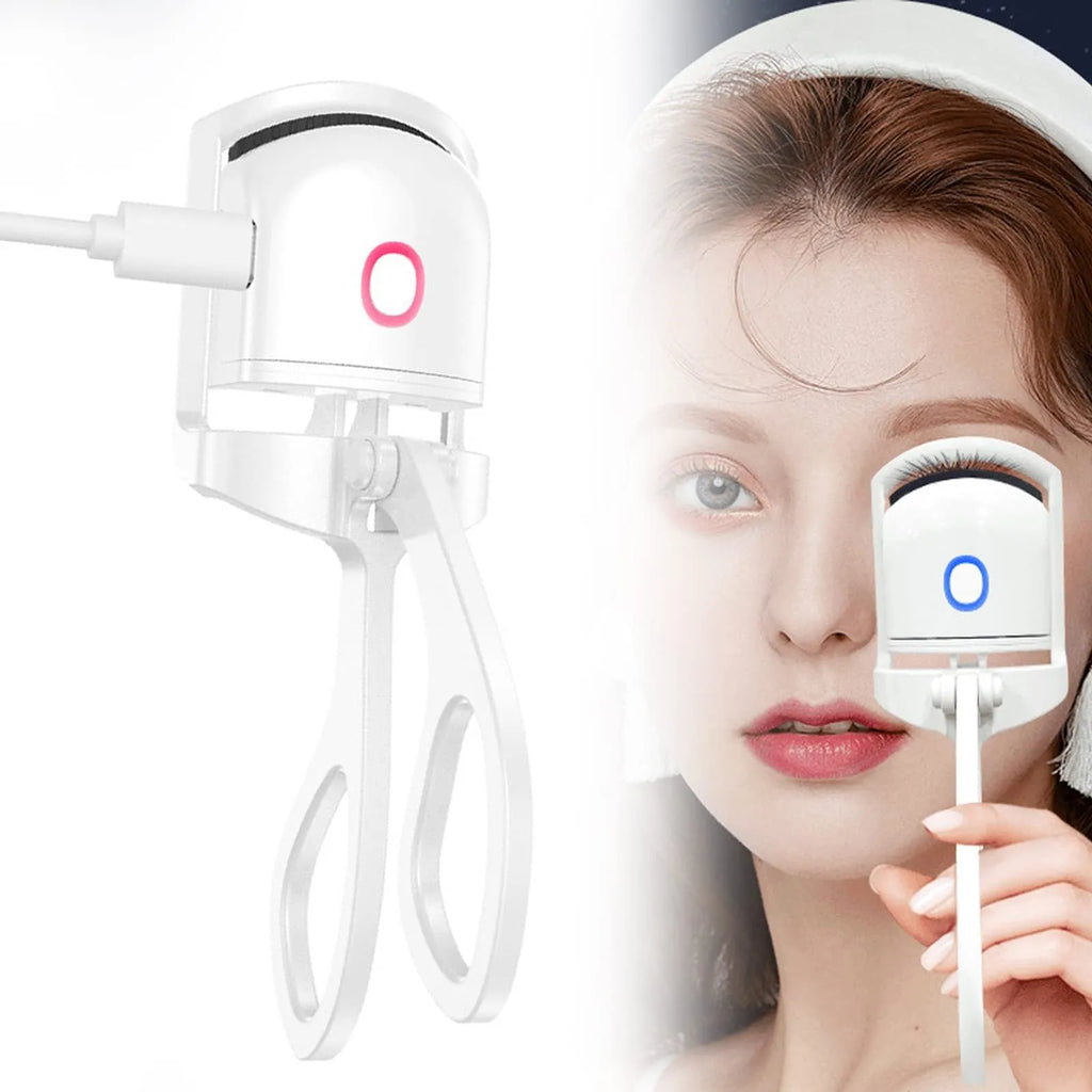 White USB rechargeable heated eyelash curler with dual temperature settings shown on a pink background.