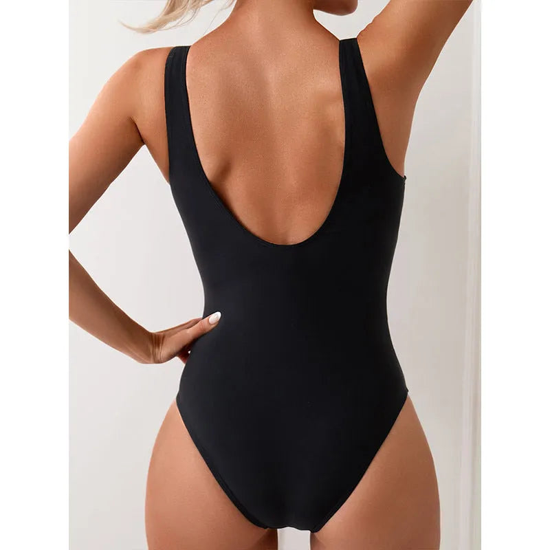 Sports one-piece swimsuit in solid colour with colour-matching, backless design, nylon fabric