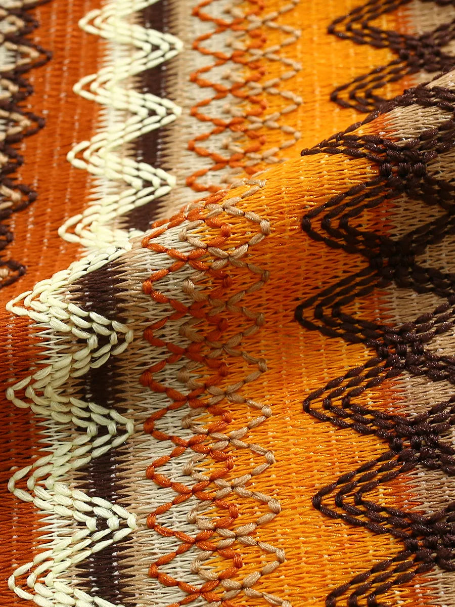 Ethnic woven Cuban collar shirt with contrast colours and short drop-shoulder sleeves.