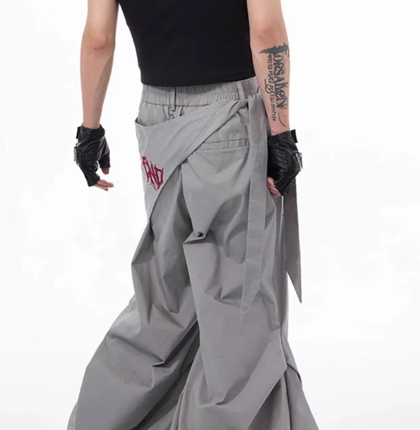 Boy wearing black wide-leg Korean style summer trousers with an elasticated waistband.